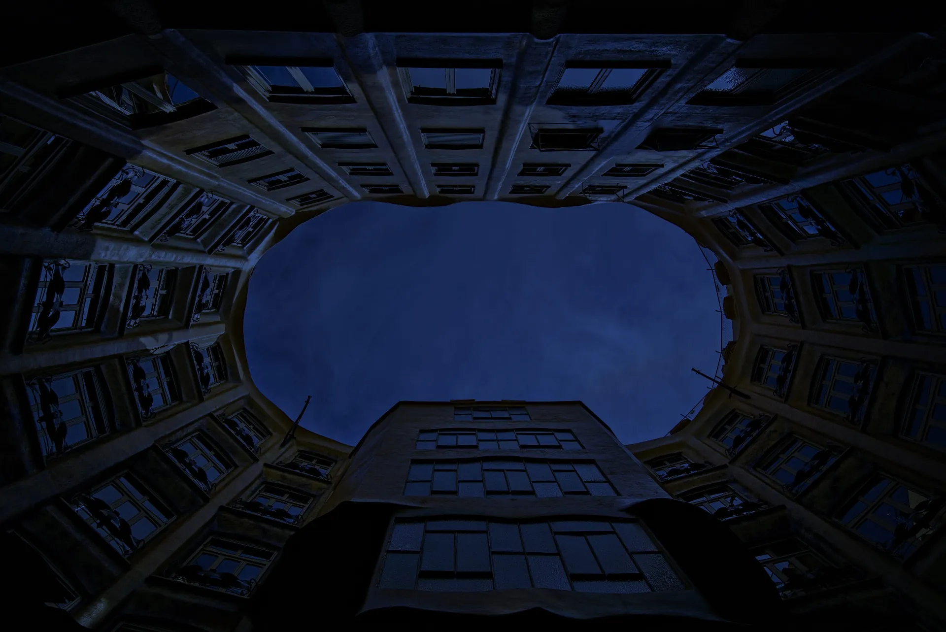 Looking up at a courtyard at dusk