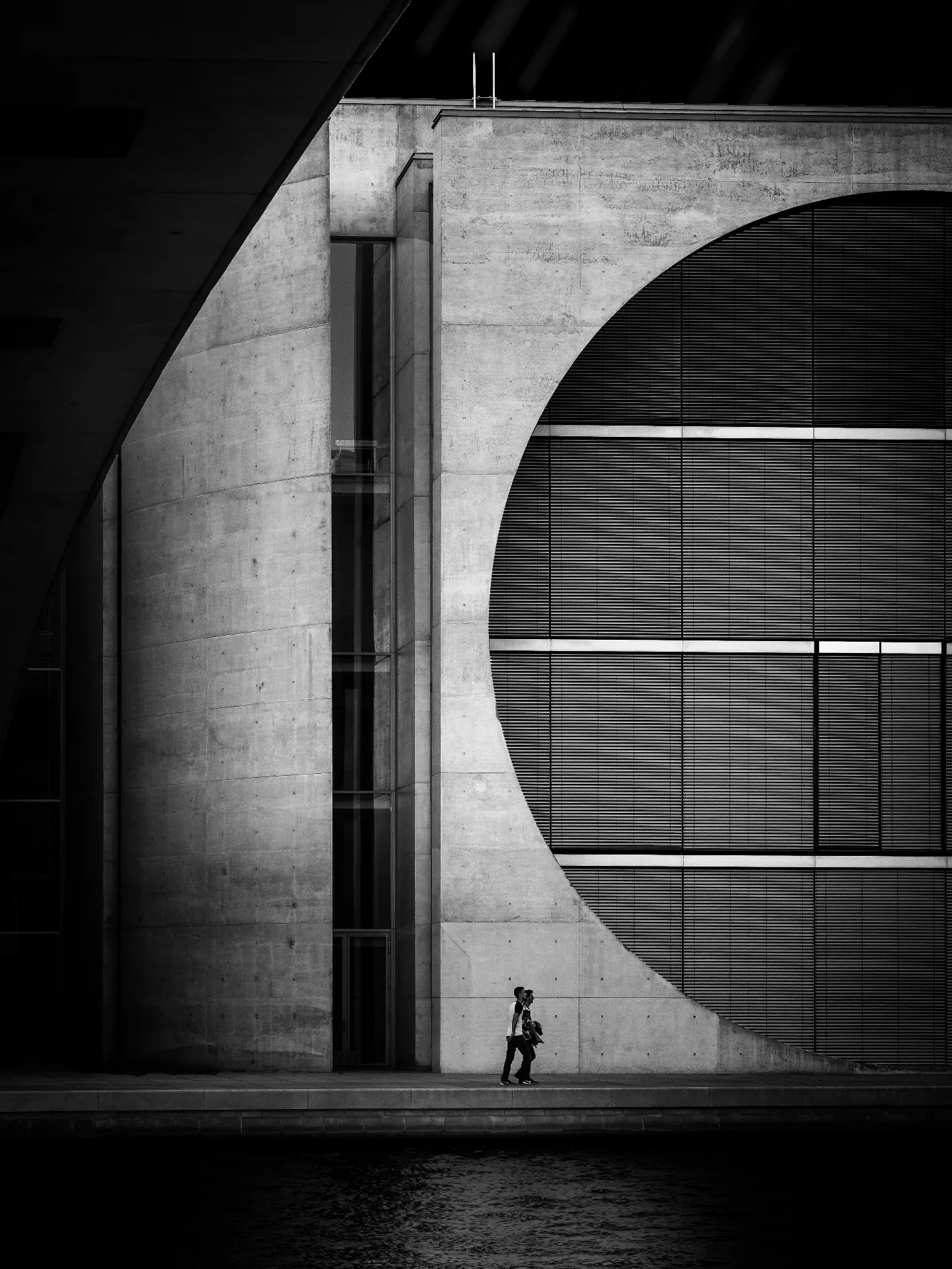 Modern architectural detail with curved concrete facade